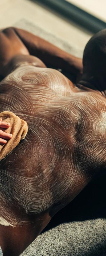 Hammam massage for man on massage table in luxury resort wellness ap at Camiral