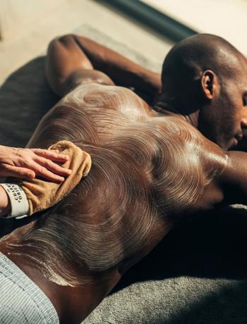 Hammam massage for man on massage table in luxury resort wellness ap at Camiral