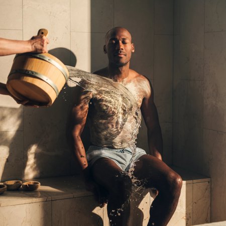 Man in blue shorts at luxury Hammam treatment at exclusive 5* resort spa