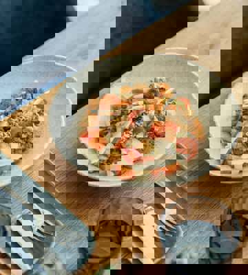 Fresh Seasonal Salad with Roasted Vegetables and Cherry Tomatoes at Camiral Bistro