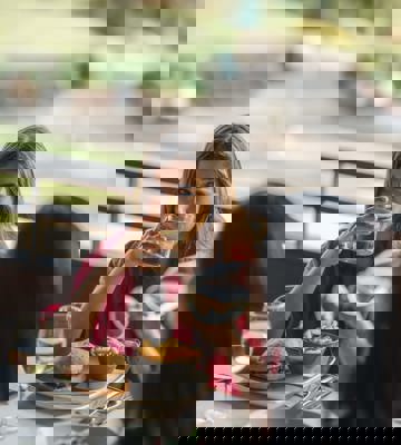 Guests Enjoying Casual Dining and Drinks at Outdoor Terrace Restaurant