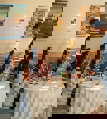 Waiter Serving Three Guests at Elegant Fine Dining Restaurant in Spain