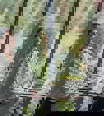 Woman enjoys rejuvenating meal at Camiral A Quinta do Lago Resort wellness spa