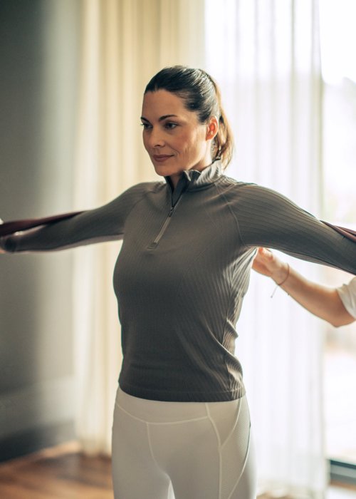 Private pilates class for woman in white yoga pants at Camiral Resort in Girona