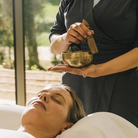 Woman experiences revive ritual at relaxing wellness spa at Camiral PGA Resort