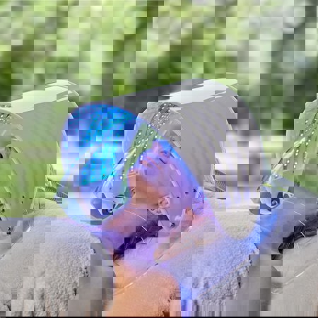 DermioCare blue light treatment with woman in blue light face mask at luxury 5* Costa Brava Resort