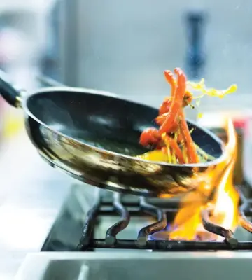 Chef Preparing Fresh Mediterranean Cuisine Near Hotel Camiral in Girona