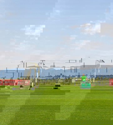 Recovery Facilities Spain - Groundskeeper Maintaining Professional Football Pitch