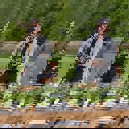 Man and woman perform music outside at the Camiral Resort in Girona