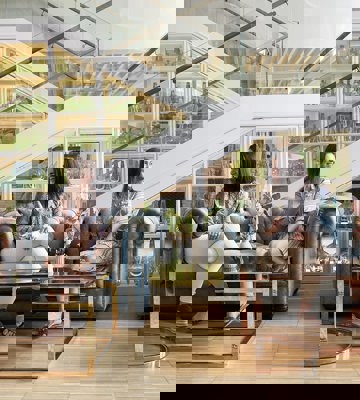 Friends Enjoying Drinks in Elegant Lounge at Camiral Resort