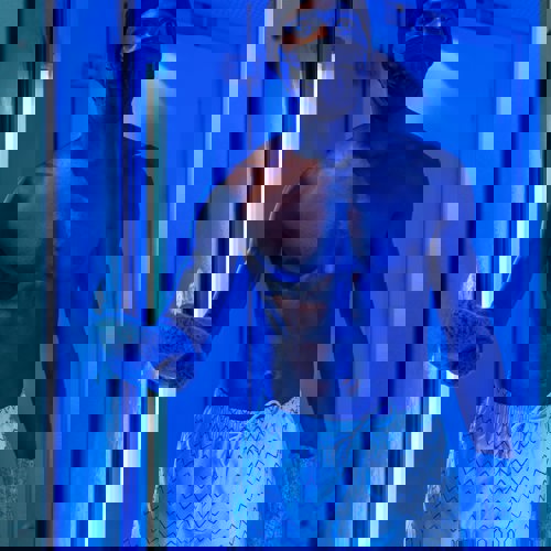 Man in white striped shorts in cryotherapy machine at Camiral 5* PGA Resort