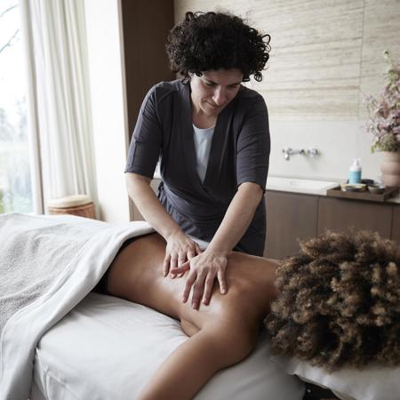 Womans back massage in luxury massage room at Camiral 5* Resort in Costa Brava