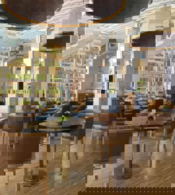 Elegant Lounge Area With Green Glass Display Wall at Camiral Resort