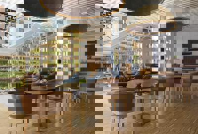 Elegant Lounge Area With Green Glass Display Wall at Camiral Resort