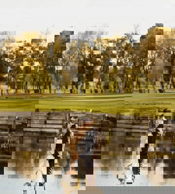 Couples Standing Beside the Lake in Camiral at their Wedding Day