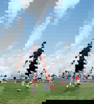 Team Training Base Spain - Professional Football Player Kicking Ball