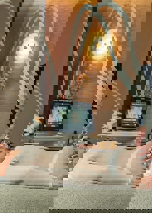 Icoone massage for woman in white body suit at the Camiral a Quinta de Lago Resort Girona