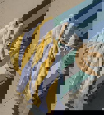 Poolside Sun Lounger With Towel Book and Straw Hat at PGA Catalunya Resort