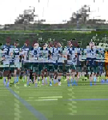 Professional Grass Training Pitches - Football Team Warming Up