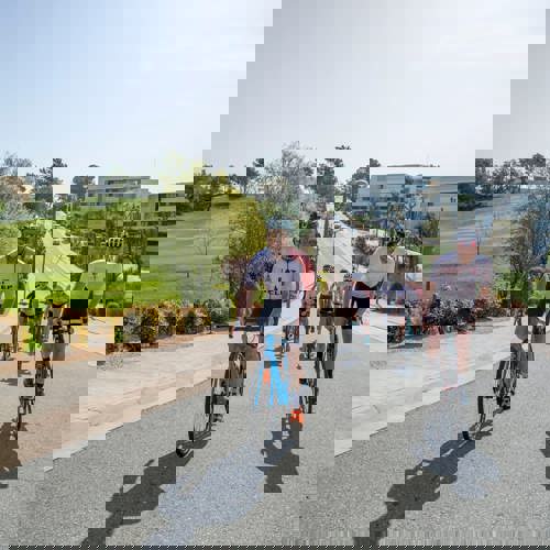 Group of Cyclists Riding Road Bikes Through PGA Catalunya Resort in Girona