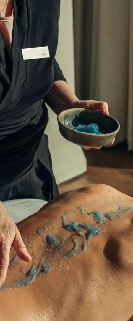 Massage exfoliation treatment for woman at luxury 5* wellness spa