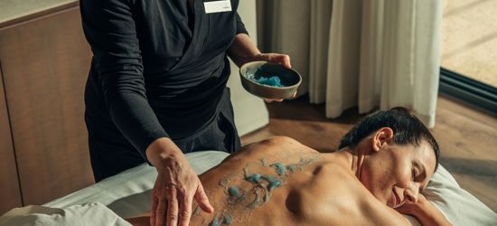 Massage exfoliation treatment for woman at luxury 5* wellness spa