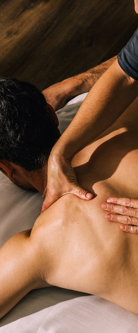 Man recieves back and shoulder massage treatment at Camiral wellness spa in costa brava