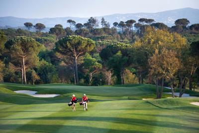 Golfers Walking Fairway at Camiral Girona