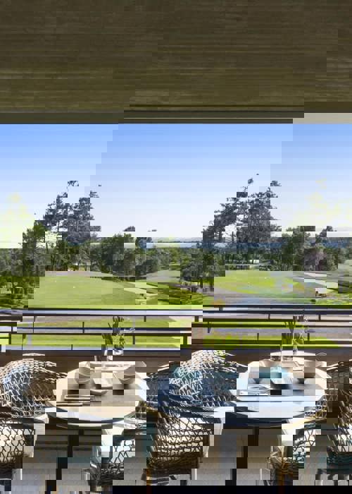 Outdoor Terrace Dining with Panoramic Golf Course Views at Camiral Resort