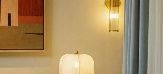 Elegant Restaurant Interior With Soft Lighting, Contemporary Wall Art And Upholstered Seating