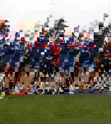 Professional Women’s Football Team Listening to Coach