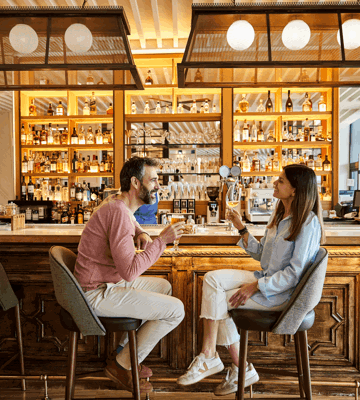 Couple Enjoying Drinks at Camiral Resort Bar in Girona
