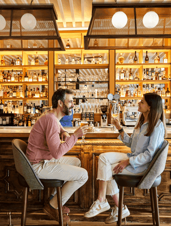 Couple Enjoying Drinks at Camiral Resort Bar in Girona