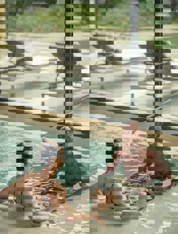 Man and womam swim and enjoy Camiral Wellness Centre Thermal Pavilion