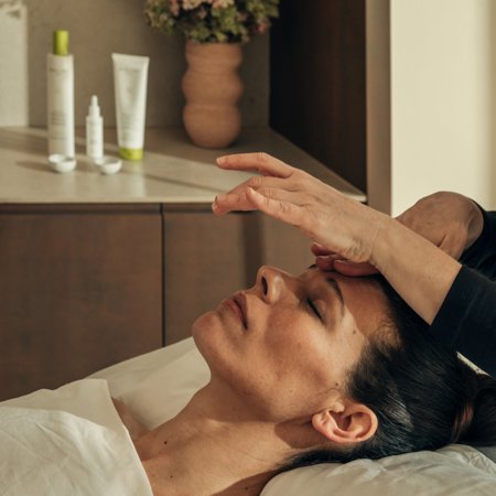 Woman receives facial massage at luxury 5* wellness spa in Spain