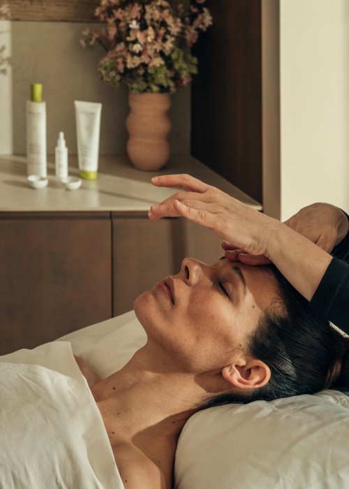 Woman receives facial massage at luxury 5* wellness spa in Spain